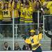 Wolverines center Cristoval Nieves and fans celebrate after Cristoval scored the Wolverines third goal of the fame during the third period of their game against the Spartans at Yost Ice Arena Friday Feb. 1st.
Courtney Sacco I AnnArbor.com   